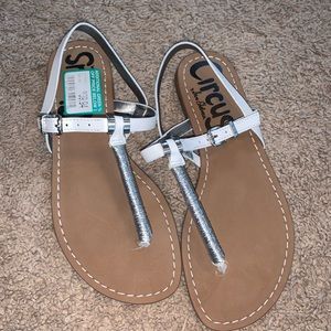 Circus sandals , white and silver . New